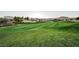Expansive golf course with lush green fairway, community homes and mountain views at 203 Sea Rim Ave, Las Vegas, NV 89148