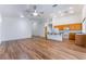 Inviting living space with wood floors, vaulted ceilings, and an open layout connecting the kitchen at 203 Sea Rim Ave, Las Vegas, NV 89148