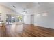 Bright living room with wood floors, high ceilings, and sliding glass doors that lead to the backyard at 203 Sea Rim Ave, Las Vegas, NV 89148
