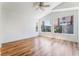 Spacious main bedroom with wood floors, ceiling fan and many bright windows at 203 Sea Rim Ave, Las Vegas, NV 89148