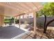 Covered patio area perfect for outdoor seating and entertaining with backyard views at 203 Sea Rim Ave, Las Vegas, NV 89148