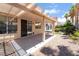 Cozy covered patio area with outdoor furniture and view of the backyard at 203 Sea Rim Ave, Las Vegas, NV 89148