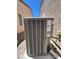 Exterior AC unit between two houses with gravel base at 2117 Bay Thrush Way, North Las Vegas, NV 89084