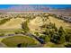 Stunning aerial view of the community featuring a lush golf course surrounded by well-maintained homes at 2117 Bay Thrush Way, North Las Vegas, NV 89084