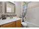 Cozy bathroom featuring a vanity with modern fixtures and a bathtub with shower at 2117 Bay Thrush Way, North Las Vegas, NV 89084