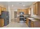 Well-equipped kitchen featuring stainless steel appliances and ample cabinet space at 2117 Bay Thrush Way, North Las Vegas, NV 89084