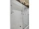 Bathroom with a glass door shower featuring a white tiled surround and silver hardware at 2117 Bay Thrush Way, North Las Vegas, NV 89084