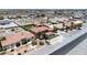 Aerial view of a beautiful home with a putting green, pool, well-maintained landscaping, and surroundings at 2181 E Winery Rd, Pahrump, NV 89048