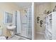 Functional bathroom equipped with accessible shower, simple sink, and storage for daily needs at 2181 E Winery Rd, Pahrump, NV 89048
