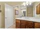 Bathroom features vanity, large mirror, and linen cabinet at 2181 E Winery Rd, Pahrump, NV 89048