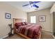Cozy bedroom featuring a wooden headboard and a window that offers natural light at 2181 E Winery Rd, Pahrump, NV 89048