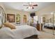 Bright bedroom with carpet, ceiling fan, and closet at 2181 E Winery Rd, Pahrump, NV 89048