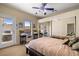 Bright bedroom with sliding door to exterior, mirrored closet, and cozy sleeping area at 2181 E Winery Rd, Pahrump, NV 89048