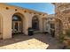 Charming home courtyard showcasing stamped concrete, stone accents, and inviting outdoor seating area with grill at 2181 E Winery Rd, Pahrump, NV 89048