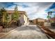 Long driveway leading to the home, featuring desert landscaping and secure gated access to the property at 2181 E Winery Rd, Pahrump, NV 89048