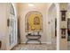 Welcoming foyer features an arched alcove, decorative artwork, and views into other rooms at 2181 E Winery Rd, Pahrump, NV 89048