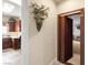 Hallway view shows a laundry room and a hidden room behind a decorative wall piece at 2181 E Winery Rd, Pahrump, NV 89048