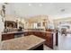 Open kitchen design with granite counters, tile flooring, and breakfast nook at 2181 E Winery Rd, Pahrump, NV 89048