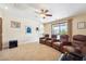 Inviting living room provides comfortable seating, carpeted floors, and access to the outdoor pool area at 2181 E Winery Rd, Pahrump, NV 89048