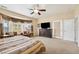 Light-filled main bedroom with a sitting area and patio doors leading to an outdoor space at 2181 E Winery Rd, Pahrump, NV 89048