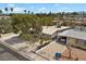 Aerial view showcasing the home's neighborhood, carport, and mature landscaping at 2408 Berkley Ave, Las Vegas, NV 89101