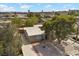 Aerial view of the home featuring mature trees, landscaping, and a brick paved driveway at 2408 Berkley Ave, Las Vegas, NV 89101