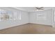 Bright bedroom with wood-look tile floors and two large windows at 2408 Berkley Ave, Las Vegas, NV 89101