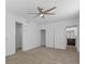 Spacious bedroom features plush carpeting, ceiling fan, and ensuite bathroom access at 2408 Berkley Ave, Las Vegas, NV 89101