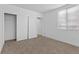Bright bedroom features sliding closet doors, modern window and plush carpeting at 2408 Berkley Ave, Las Vegas, NV 89101