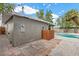 View of the home's backyard, featuring a private in-ground pool, landscaping, and storage at 2408 Berkley Ave, Las Vegas, NV 89101
