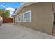 This home's exterior features a neutral color scheme, a spacious driveway, and fenced yard at 2408 Berkley Ave, Las Vegas, NV 89101