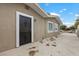 Home's exterior showcasing a secure gate and neutral tones, plus decorative window security at 2408 Berkley Ave, Las Vegas, NV 89101