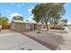 View of front exterior features desert landscaping, and a paved driveway at 2408 Berkley Ave, Las Vegas, NV 89101
