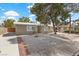 View of front exterior features desert landscaping, and a paved driveway at 2408 Berkley Ave, Las Vegas, NV 89101