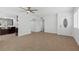 Bright living room with neutral tile flooring and seamless flow into the kitchen at 2408 Berkley Ave, Las Vegas, NV 89101