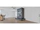Bright living room showcasing black brick fireplace, tile floors, and white trim at 2408 Berkley Ave, Las Vegas, NV 89101