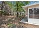 Spacious backyard featuring mature trees, and a covered patio perfect for outdoor entertaining and relaxation at 3201 Beacon Shores Cir, Las Vegas, NV 89117