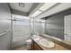 Clean bathroom featuring a shower-tub combo and granite countertops at 3201 Beacon Shores Cir, Las Vegas, NV 89117