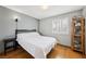 Serene bedroom featuring natural light and hardwood flooring at 3201 Beacon Shores Cir, Las Vegas, NV 89117