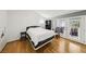 Bright bedroom features bamboo floors and a private door to backyard area at 3201 Beacon Shores Cir, Las Vegas, NV 89117