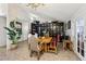Elegant dining room featuring hardwood floors, stylish lighting and black display cabinets at 3201 Beacon Shores Cir, Las Vegas, NV 89117