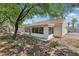 The house has a covered sunroom and a large backyard, perfect for enjoying the outdoors at 3201 Beacon Shores Cir, Las Vegas, NV 89117