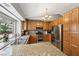 Bright kitchen with stainless steel appliances, granite countertops, and ample natural light at 3201 Beacon Shores Cir, Las Vegas, NV 89117