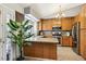 Traditional kitchen with granite countertops, stainless steel appliances, and wood cabinets at 3201 Beacon Shores Cir, Las Vegas, NV 89117