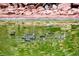 Charming view of a mother duck and ducklings swimming in a pond with vibrant green water at 3201 Beacon Shores Cir, Las Vegas, NV 89117