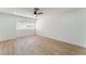Bright and airy bedroom featuring vinyl floors, fresh paint, new window, and updated ceiling fan at 3409 El Cortez Ave, Las Vegas, NV 89102
