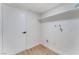 Bright utility room with crisp white walls, luxury vinyl floors, and a door at 3409 El Cortez Ave, Las Vegas, NV 89102
