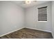 Cozy bedroom with hardwood floors and a modern window shade at 3484 Bradano Ln, Henderson, NV 89044