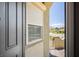Stylish front door with modern security shutters and a peek at the inviting neighborhood beyond at 3484 Bradano Ln, Henderson, NV 89044