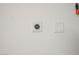 Garage wall featuring a 220 volt outlet and cover plate at 3484 Bradano Ln, Henderson, NV 89044